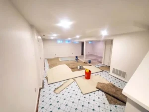 Basement renovation in St. Louis with freshly painted white walls and trim, part of Malone Painting’s interior painting and home improvement services.