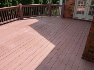 Spacious wooden deck with a fresh brown finish, professionally Stained and protected by Malone Painting for long-lasting durability in St. Louis homes.