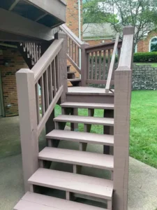 St. Louis home with freshly Stained wooden deck stairs in a durable brown finish, restored by Malone Painting exterior wood staining services.