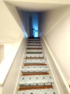 Basement renovation in St. Louis with freshly painted white walls and trim, part of Malone Painting’s interior painting and home improvement services.