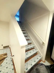 Basement renovation in St. Louis with freshly painted white walls and trim, part of Malone Painting’s interior painting and home improvement services.