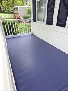 Professional porch and steps painting service, highlighting a clean, modern finish on a residential concrete porch.