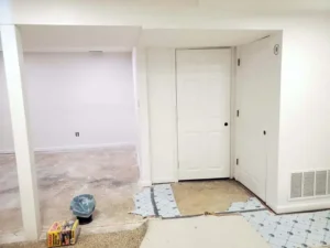 Basement renovation in St. Louis with freshly painted white walls and trim, part of Malone Painting’s interior painting and home improvement services.
