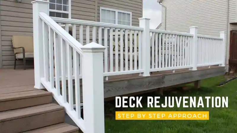 A deck with brown composite flooring and a clean white railing. The deck steps are in the foreground, and a chair and a table are on the deck. A yellow text overlay reads "DECK REJUVENATION STEP BY STEP APPROACH."