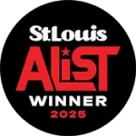 A black circular logo with white and red text. The white text at the top says "St. Louis". The word "A-LIST" is in large red letters below it, with a white star inside the letter 'A'. Below that, the white text says "WINNER" and below that, in red text, it says "2025".
